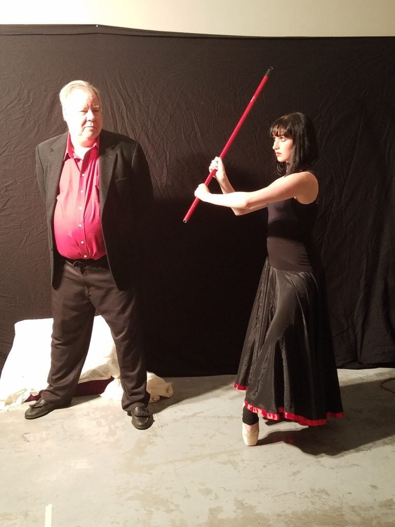 Madeline posing with the baseball bat in Kevin Grass's Not #MeToo project