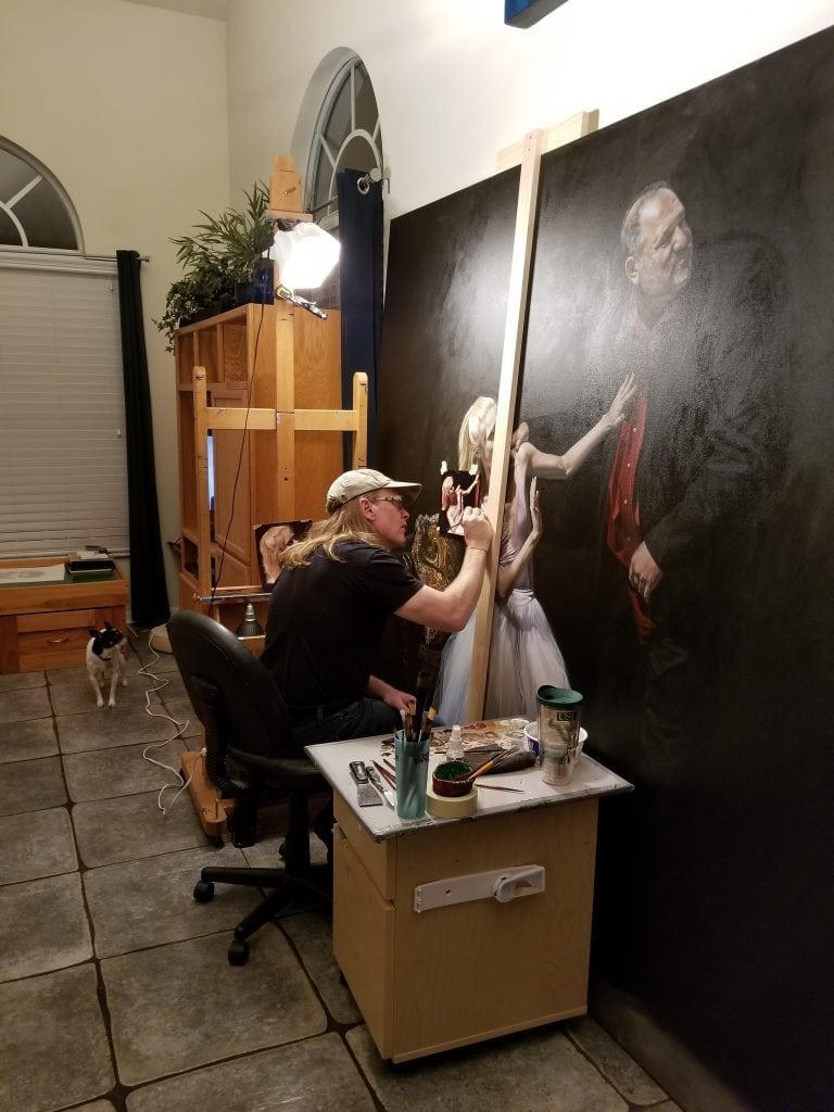 Florida artist Kevin Grass works on his large Not #MeToo: No More Casting Couch painting in his living room. 