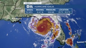 A doppler map of Hurricane Idalia is shown. Swirls of red, orange, and purple make up the body of the storm.