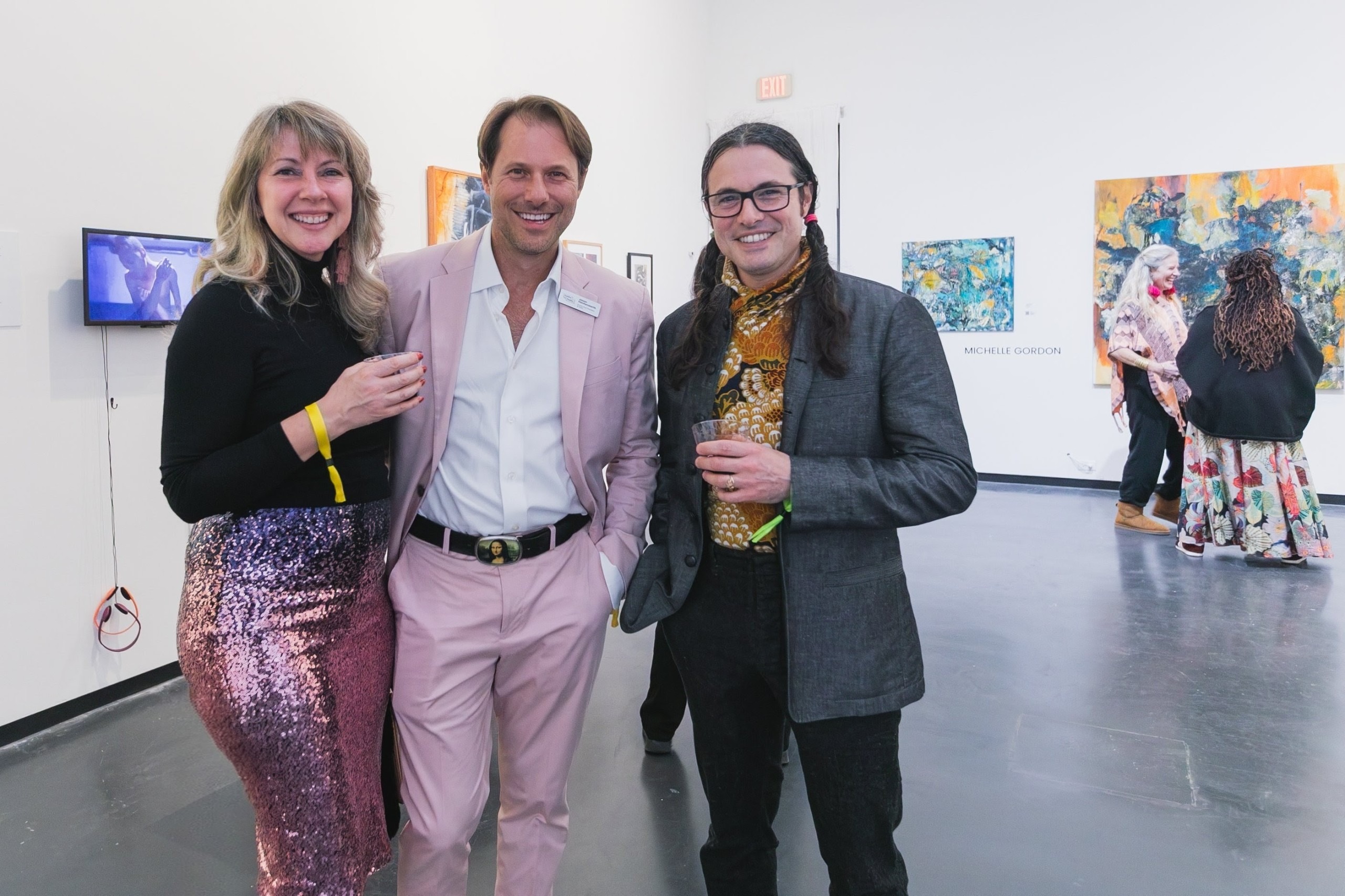 People pose for a photo at a party.