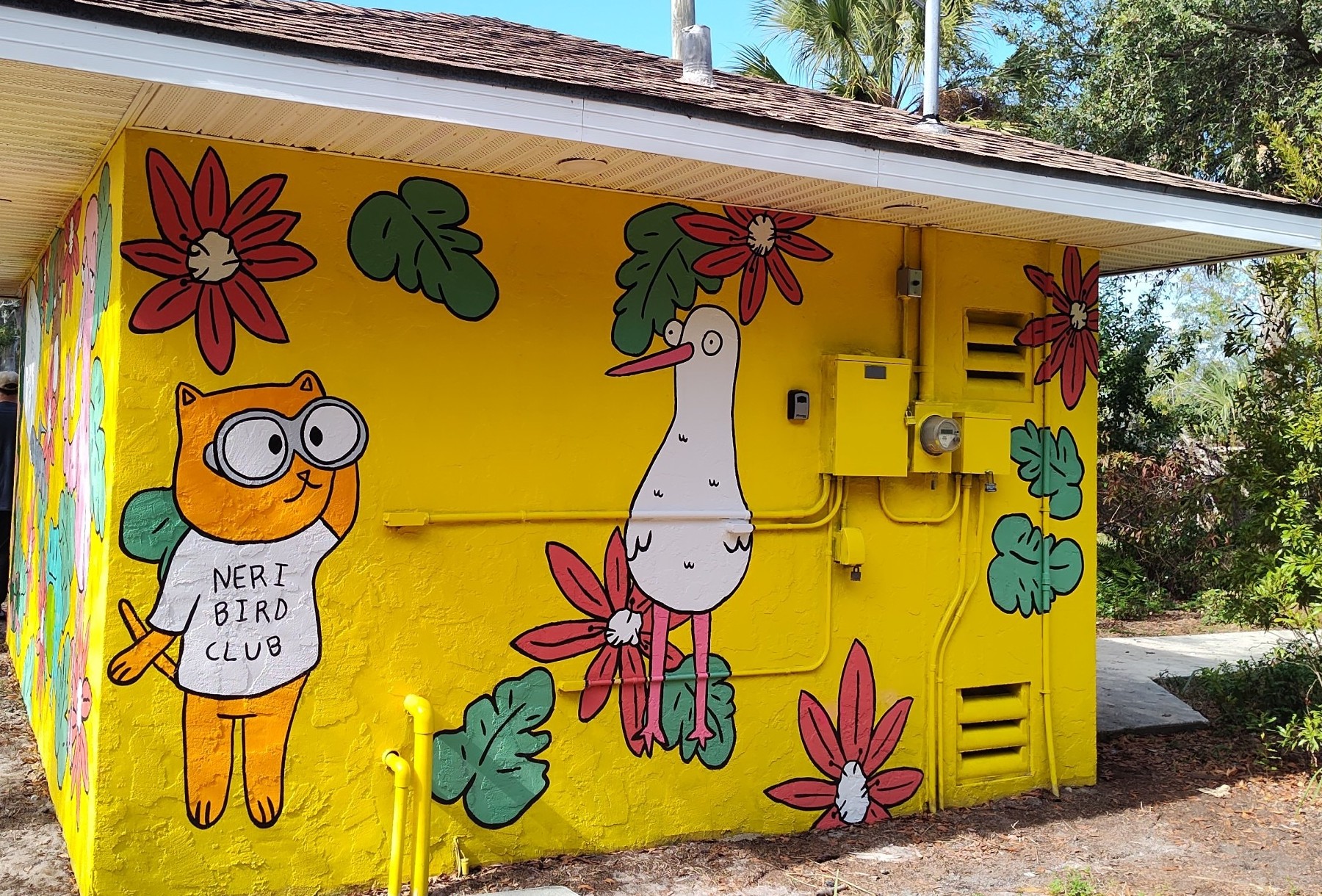 A mural depicts animals and plants.