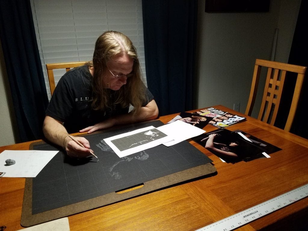 Kevin Grass is shown here working on the first drawing of the Not #MeToo composition