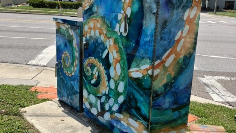 A signal box is decorated with an octopus.