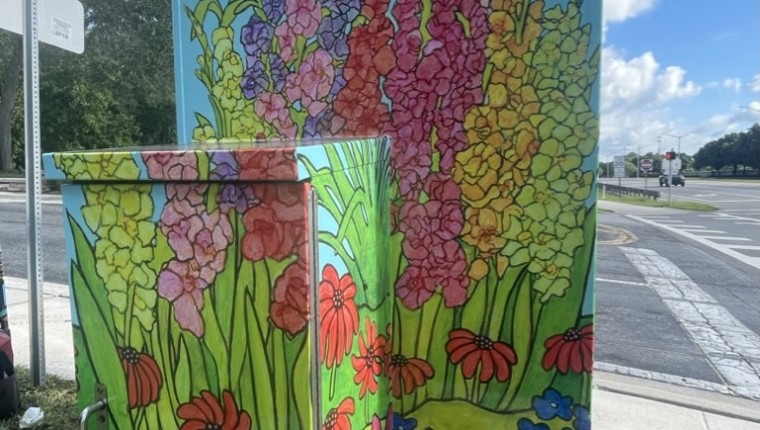 A signal box is decorated with flowers.