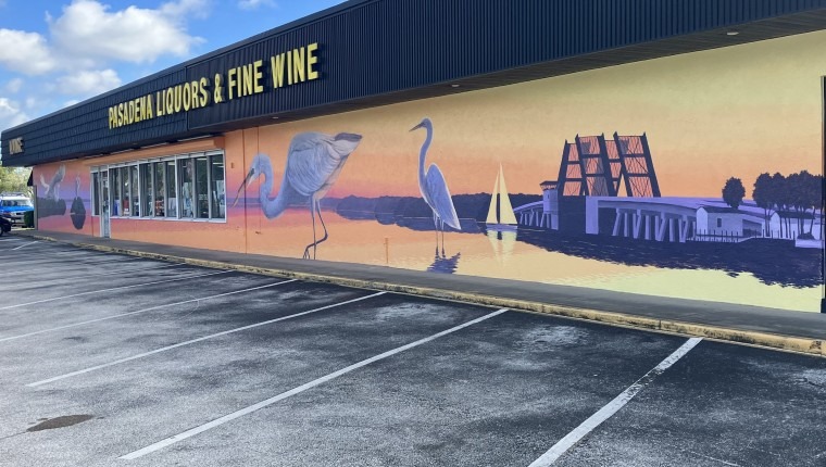 A mural depicts birds.