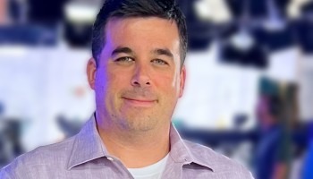 A man poses for a portrait.