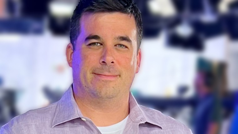 A man poses for a portrait.