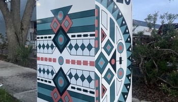 A signal box decorated with a pattern.