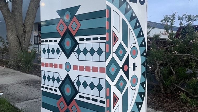 A signal box decorated with a pattern.